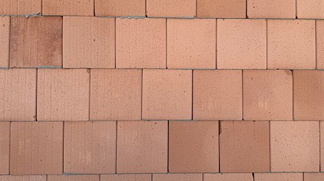 Titel der Produktbroschüre BauStatik - Mauerwerk. Zu sehen ist eine Mauerwerkswand aus roten Steinen.